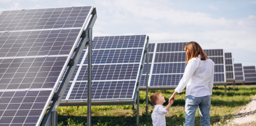 This image: a photo of a mother and child walking alongside rows
					 		 of solar panels on a solar farm.
							 The map: The map shows the site boundary and wider area,
							 including Castletown to the south, Ballabeg to the northwest and
							 Ballasalla to the northeast. Interactive map markers show
							 illustrative photos of example community initiatives, which may benefit
							 from Peel Cubico Renewable's community benefits contribution.